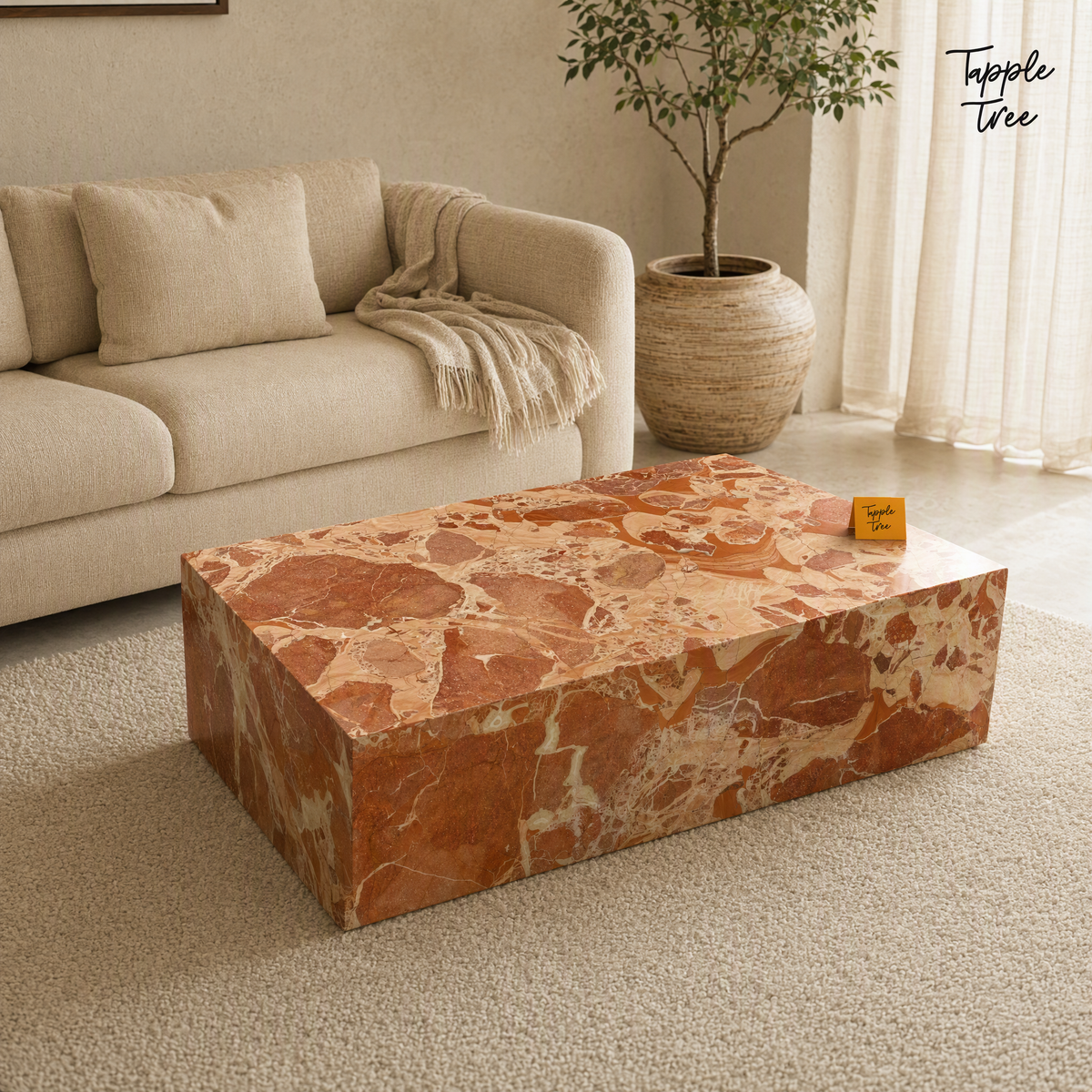Imported stone coffee table — lifestyle opposite angle; glossy terracotta and cream finish