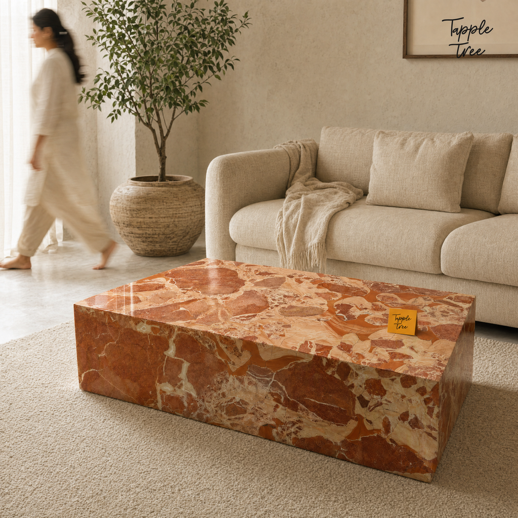 Imported stone coffee table — lifestyle walking woman; glossy terracotta and cream finish