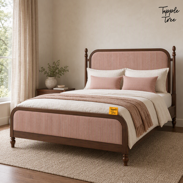 Rust Stripe Teak Upholstered Bed, lifestyle view with a removable Tapple Tree tag resting on the bed and a small corner logo