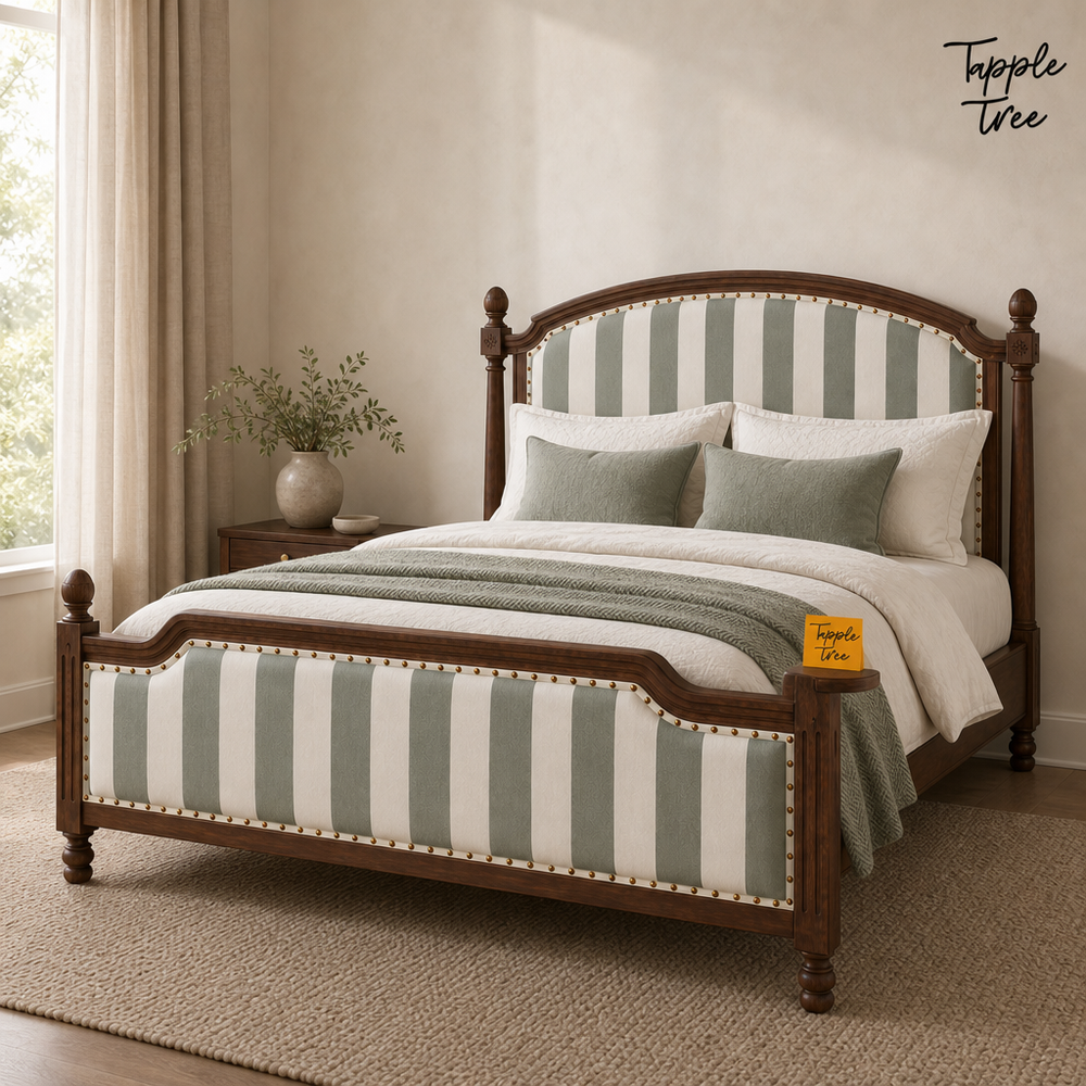 Sage Stripe Arched Teak Bed, lifestyle view with a removable Tapple Tree tag resting on the bed and a small corner logo