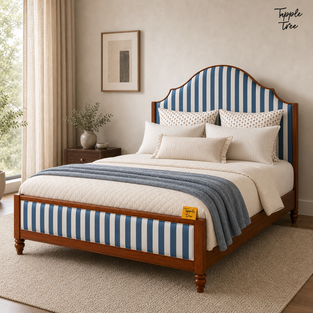 Indigo Stripe Scalloped Teak Bed, lifestyle view with a removable Tapple Tree tag resting on the bed and a small corner logo