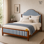 Indigo Stripe Scalloped Teak Bed, lifestyle view with a removable Tapple Tree tag resting on the bed and a small corner logo