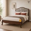 Paisley Curve Teak Bed, lifestyle view with a removable Tapple Tree tag resting on the bed and a small corner logo