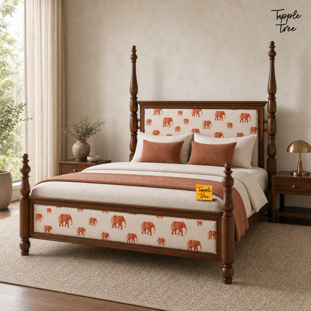 Elephant Motif Teak Poster Bed, lifestyle view with a removable Tapple Tree tag resting on the bed and a small corner logo