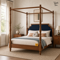 Midnight Blue Teak Canopy Bed, lifestyle view with a removable Tapple Tree tag resting on the bed and a small corner logo