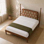 Elevated view of the Tapple Tree botanical teak upholstered bed with white bedding and an olive throw