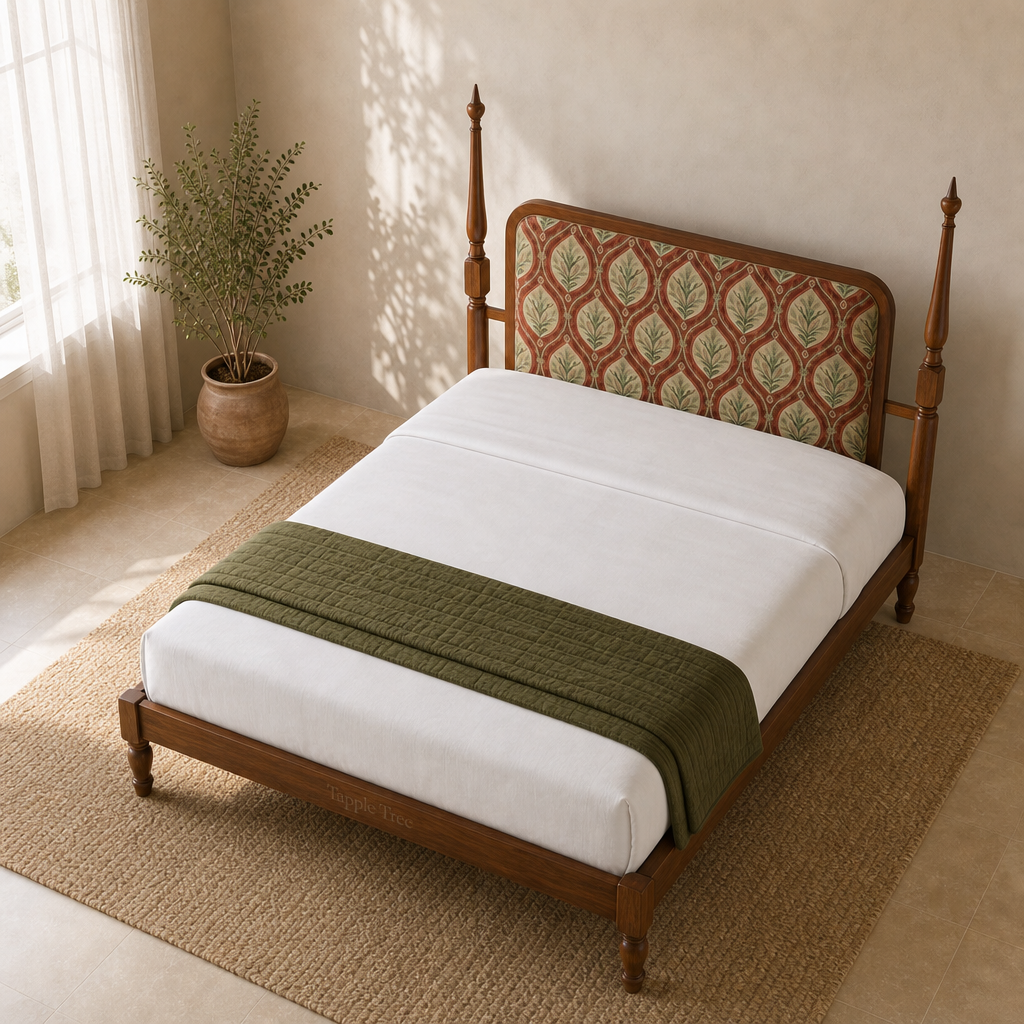 Elevated view of the Tapple Tree botanical teak upholstered bed with white bedding and an olive throw