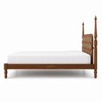 Side profile of the Tapple Tree botanical teak upholstered bed on a white background