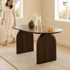 Walnut Arch Acacia Dining Table — lifestyle walking woman