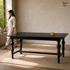 Noir Trestle Mango Dining Table — lifestyle walking woman