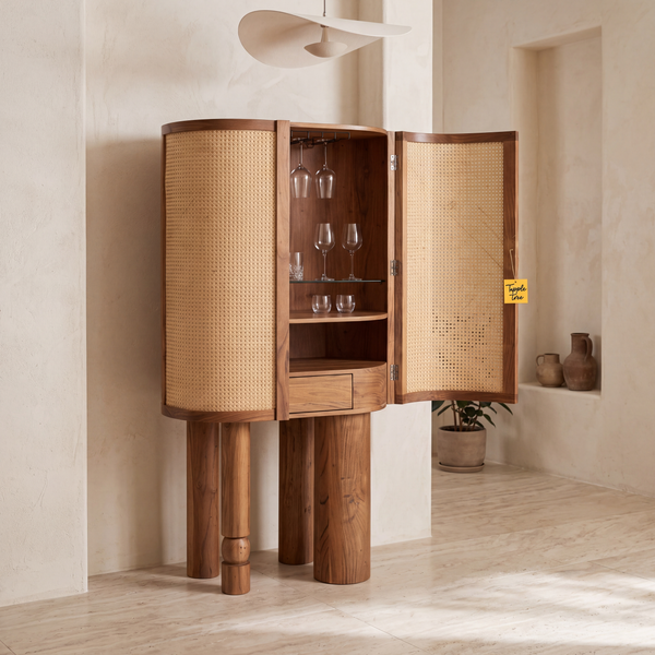 Alden Fern Cane and Acacia Wood Bar Cabinet — main lifestyle view