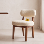 Dorian Meadow Bouclé Mango Wood Dining Chairs (Set of 2) in an Amber Solace finish, styled in a dining room