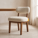 Dorian Meadow Bouclé Mango Wood Dining Chairs (Set of 2), three-quarter view in a dining room