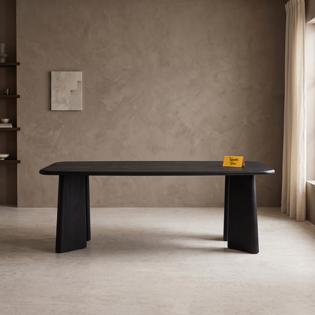 Noir Tapered Black Mango Wood 6-Seater Dining Table, front view in a dining room