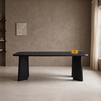 Noir Tapered Black Mango Wood 6-Seater Dining Table, front view in a dining room