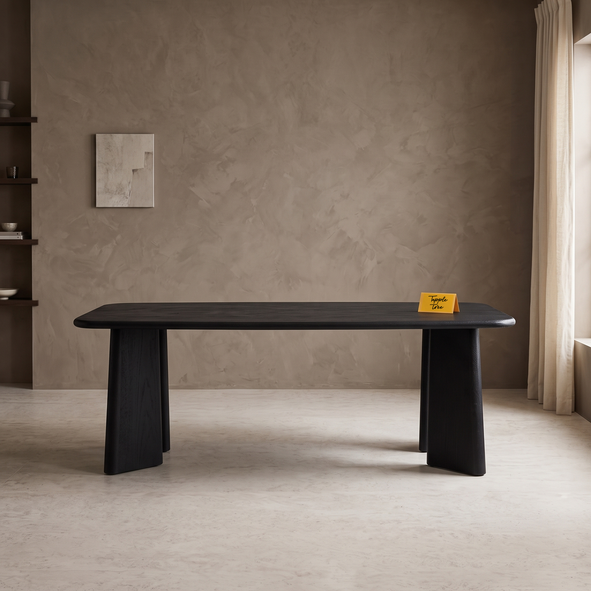 Noir Tapered Black Mango Wood 6-Seater Dining Table, front view in a dining room