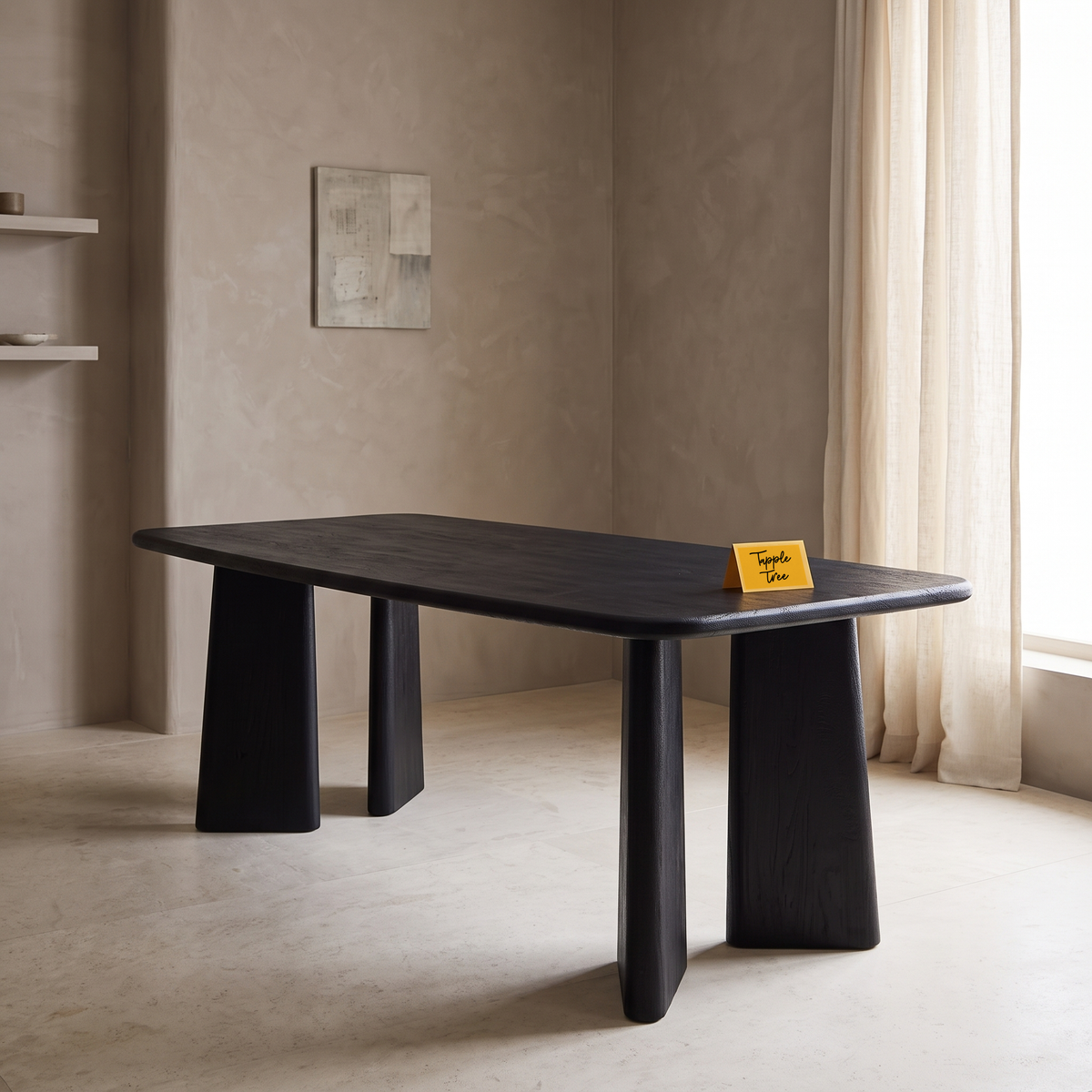 Noir Tapered Black Mango Wood 6-Seater Dining Table, side view in a dining room