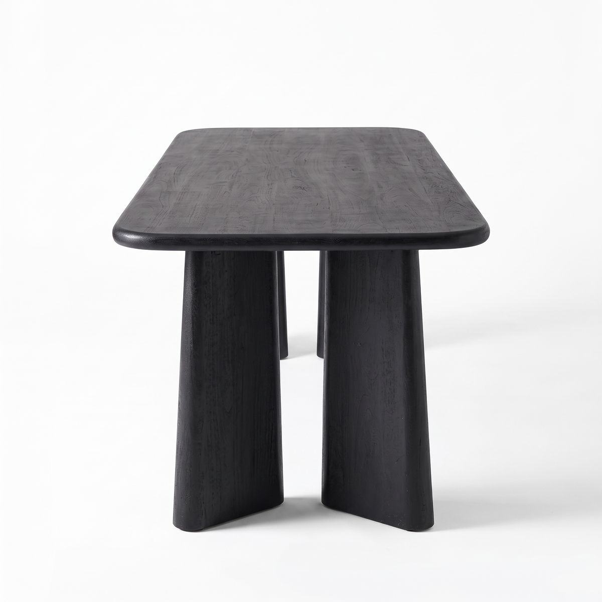 Noir Tapered Black Mango Wood 6-Seater Dining Table, right three-quarter view on a white background