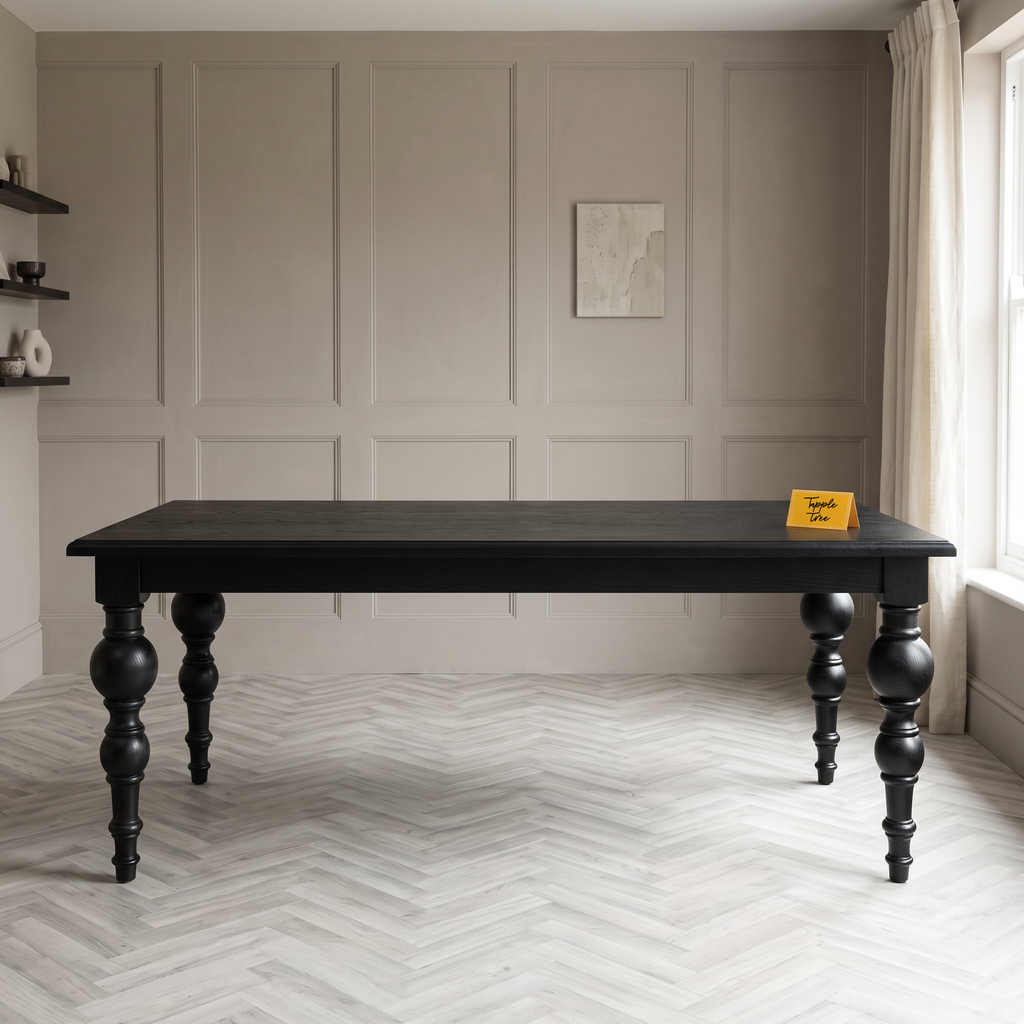 Noir Trestle Black Mango Wood 6-Seater Dining Table, front view in a dining room