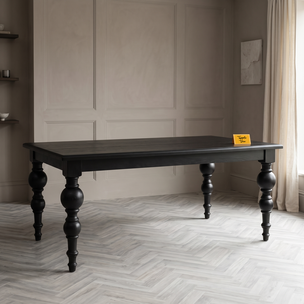 Noir Trestle Black Mango Wood 6-Seater Dining Table, three-quarter view in a dining room