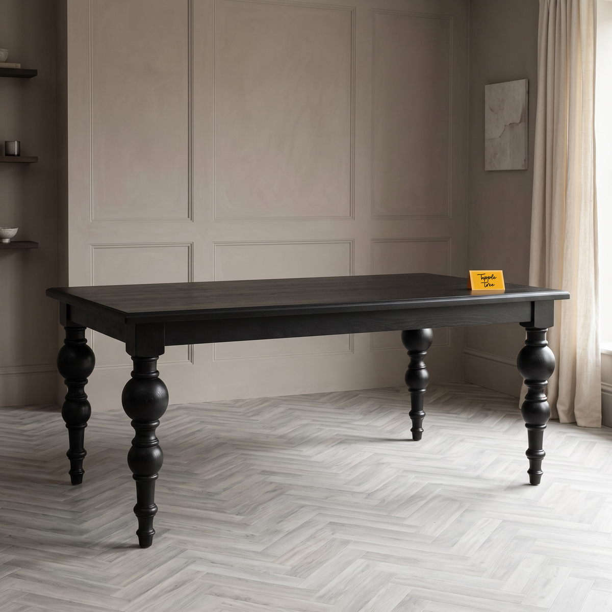 Noir Trestle Black Mango Wood 6-Seater Dining Table, three-quarter view in a dining room