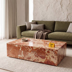 Terra Stone Sculptural Coffee Table in a glossy finish, styled in a living room