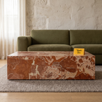 Terra Stone Sculptural Coffee Table, front view in a living room